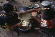 Karen refugee women in Mae Lui village preparing Soya