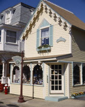 Oak Bluffs old town with yellow and green weatherboard shop on street corner