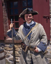 Fortress of Louisbourg with a smiling costumed soldier