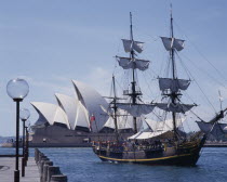 The Bounty harbour cruise ship arriving at The Rocks with the Opera House behind
