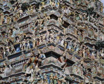 Kapaleeshwara Temple.  Detail of Dravidian style gopuram or pyramidal gateway showing multiple carved figures.
