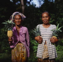 Two ladies near Senggigi holding pineapples