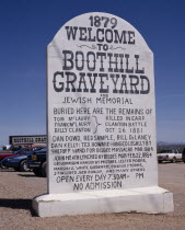 Boothill Graveyard. Large stone sign in shape of gravestone listing the famous graves and the Gunfight at the OK Corral