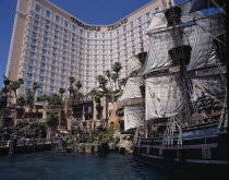 Treasure Island Hotel and Casino. Hotel entrance with pirate ship and pool.