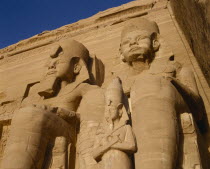 Temple of Ramses II dedicated to the gods Haramakis Amon Ra and Ptah.  Detail of stone colossi.