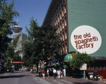 Gastown. The Old Spaghetti Factory restaurant with people on the pavement