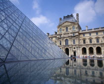 Louvre.  Cour Napoleon and glass pyramid reflected in water