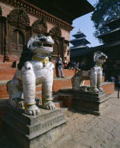 Durbar Square.  Two lion statues at entrance to temple.