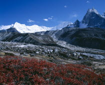 Himalayan mountain peaks with glacial debris in the foreground