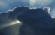 The rays of the sun breaking from behind cloudsSurly White