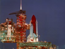 Columbia space shuttle on the launch pad at night