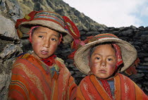Tastayoc Village.  Head and shoulders portrait of  Quechua Indian boys wearing traditional clothing.Cuzco Cusco