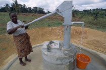 Young woman pumping clean water from UNHCR supplied water pump. United Nations High Commission for Refugees  United Nations High Commission for Refugees
