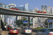 Elevated highway and traffic with city skyscrapers behind. Former crown colony reverted to Chinese rule in 1997