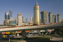 View of Pudong from the Bund.  Elevated roadway  shops and skyscrapers.Asia Asian Chinese Chungkuo Jhongguo Zhongguo Jhonggu Zhonggu