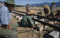 Making repairs to the single railway track on the Mandalay to Myitkyina line. Burma