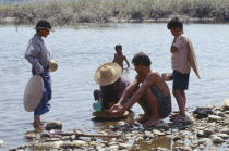 Kachin people panning for Gold in the upper Ayeyarwady RiverBurma Myanmar