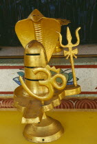 Golden statue encorporating the symbols of the Hindu god Siva at the Kuan Yin Centre
