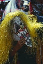 Phi Ta Khon or Spirit Festival. Person wearing elaborate spirit mask