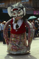 Phi Ta Khon or Spirit Festival. Person wearing spirit costume during parade