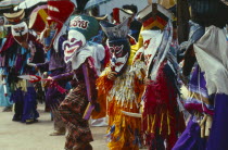 Phi Ta Khon or Spirit Festival. Group of spirits in costumes and masks dancing