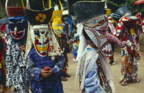 Phi Ta Khon or Spirit Festival. Group of spirits in costume and masks at Wat Phon Chai