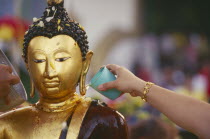 Inthakhin Ceremony. Bathing Phra Fon Saen Ha Buddha statue