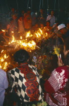Inthakhin Ceremony. People offering candles and joss sticks