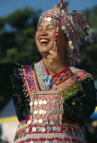 Hmong New Year. Young blue Hmong woman in her New Year finery laughing