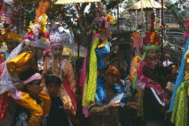 Shan Poi San Long. Crystal Children ceremony with Luk Kaeo in costume at stupa Wat Pa Pao