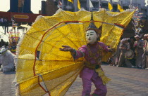 Shan Poi San Long. Crystal Children ceremony dancer with large yellow fan costume