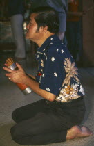 Chinese New Year. Worshipper at a Chinese temple during the New Year