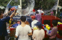 Songkran aka Lunar New Year. Revellers in a pickup truck attempting to catch some of the water thrown at themLorry