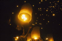 Loi Krathong Festival aka Yi Peng. People launching hot air balloons into the night sky