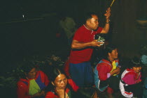 New Year. Shaman performing ceremony to cure villagers afflictions