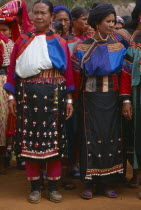 Lisu women wearing seldom worn aprons with silver ear chains for New Year