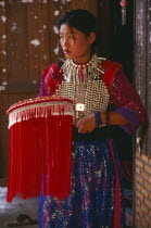 Young Lisu woman in her New Year finery prior to going to a New Year dance