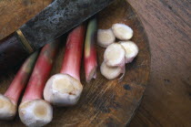 Galangal a golf club shaped ginger with sliced ends