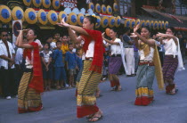 Dancers in traditional northern Thai attire performing traditional Thai dance at the Umbrella Festival