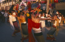 Dancers in traditional northern Thai attire performing traditional Thai dance at the Umbrella Festival