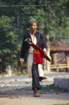 Manaw grounds. Old Jinghpaw man in traditional attire with sword and shoulder bagBurma Myanmar