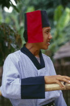 Portrait of a Lisu man with Mahkhong marks on his neck in traditional Lisu attire of the Putao areaBurma Myanmar