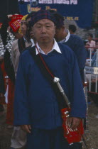 Kachin Manou. Kachin elder in line awaiting the start of a Manou dance