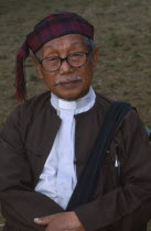 Portrait of a Jinghpaw elder at Manou ceremony