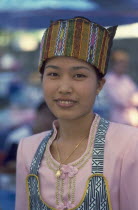 Portrait of a young Shan woman in traditional Shan attire at a food shop during Poi Sang Long
