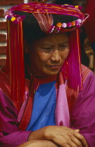 Portrait of a Lisu woman in traditional Lisu attire and hat
