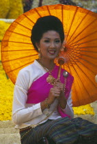 Portrait of young woman riding the beauty contest float in the Flower Festival parade