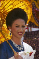 Portrait of young woman riding the beauty contest float in the Flower Festival parade