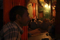 Dasashwamedh Ghat. Hindus listen to a Bhramin pundit lecturing in a temple