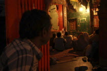 Dasashwamedh Ghat. Hindus listen to a Bhramin pundit lecturing in a temple